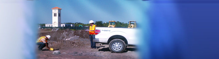 People by AEI truck at a work site